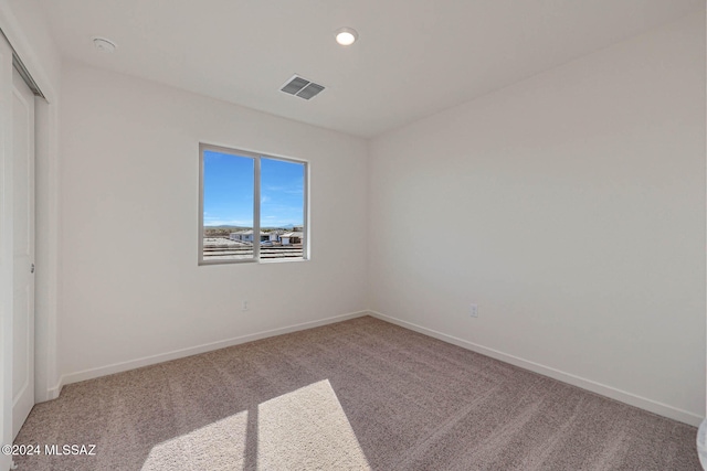 empty room featuring carpet flooring