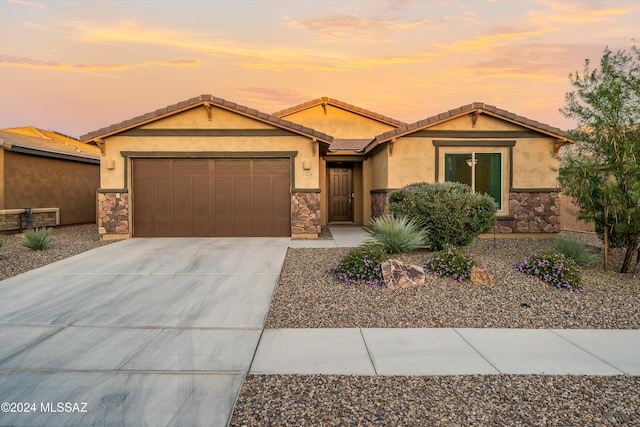 ranch-style home with a garage