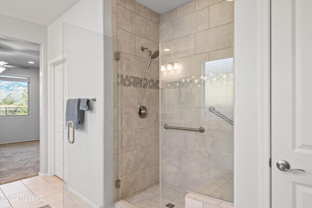 bathroom with walk in shower and tile patterned floors