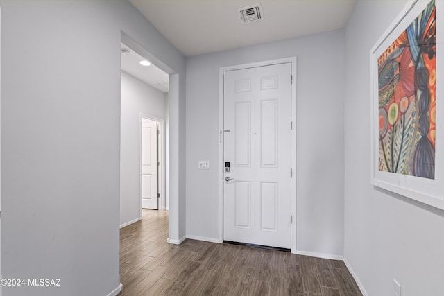 corridor with dark hardwood / wood-style floors