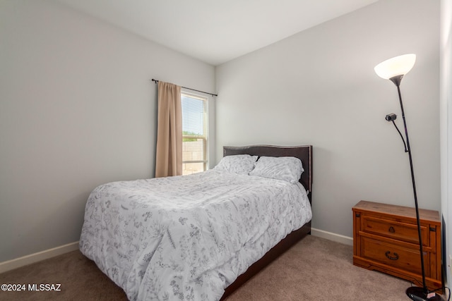 bedroom with light carpet