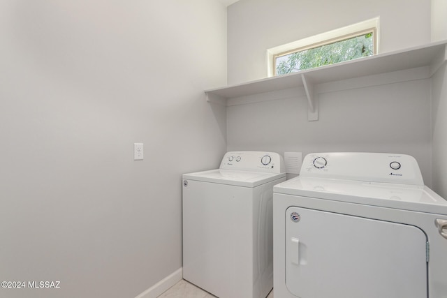 washroom with washer and dryer