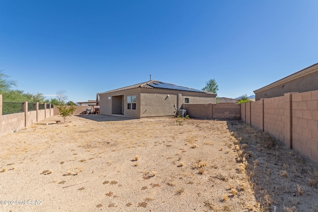 back of property with central AC unit