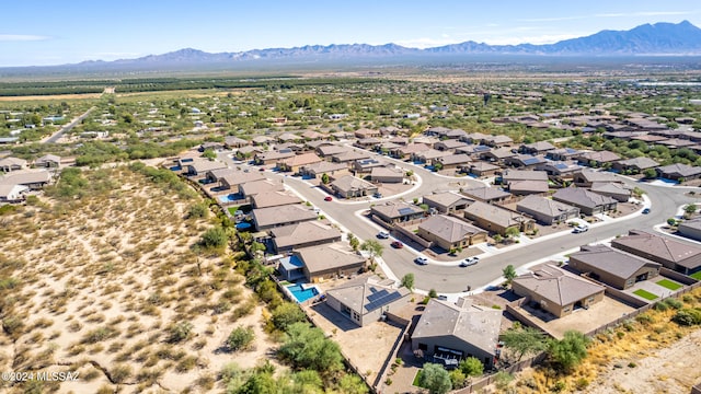 birds eye view of property featuring a mountain view