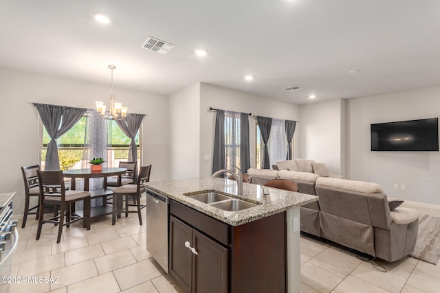 kitchen featuring sink, hanging light fixtures, dark brown cabinets, a notable chandelier, and dishwasher