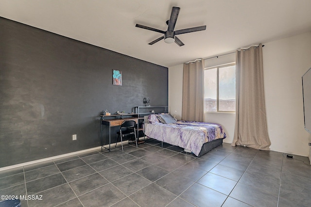 tiled bedroom with ceiling fan