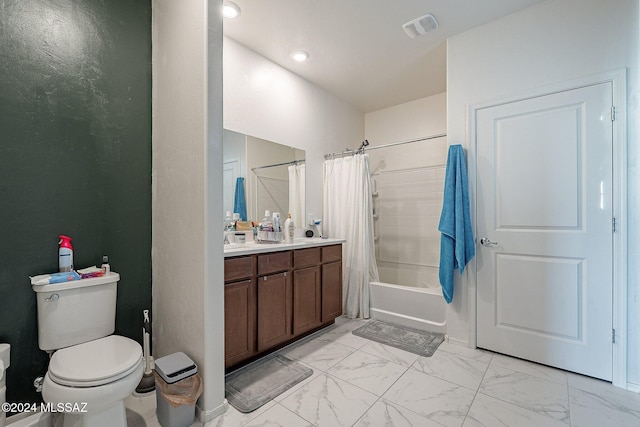 full bathroom featuring shower / tub combo, vanity, and toilet