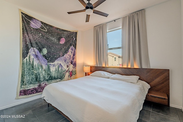 tiled bedroom with ceiling fan