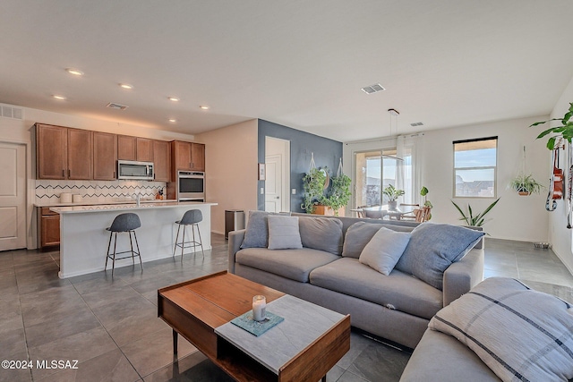 living room featuring sink