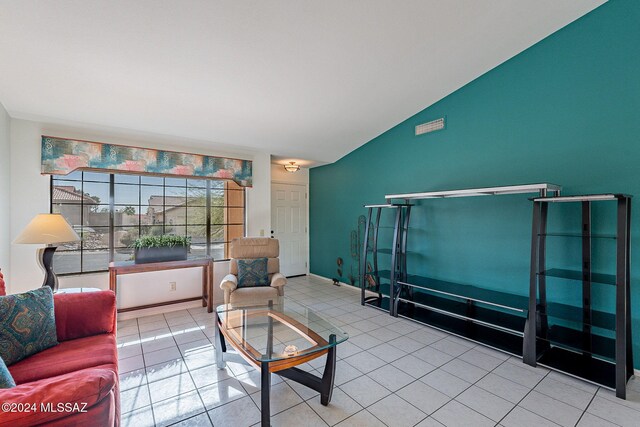 tiled living room with vaulted ceiling