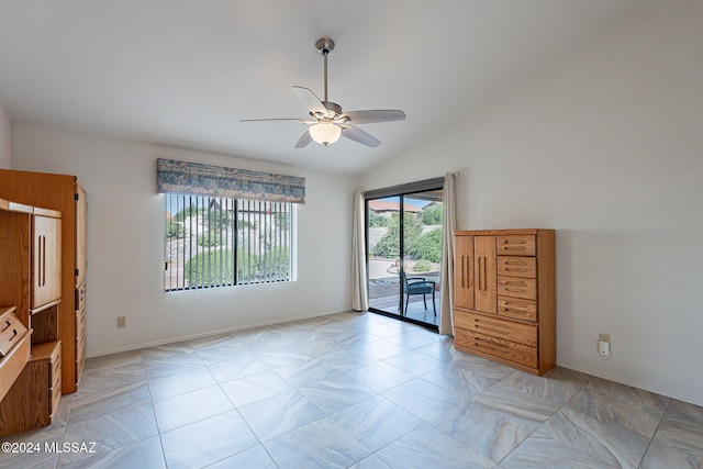 unfurnished room with ceiling fan and lofted ceiling