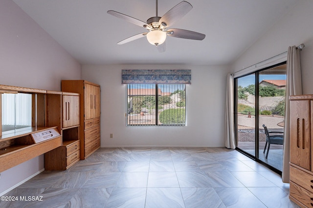 interior space with ceiling fan and lofted ceiling