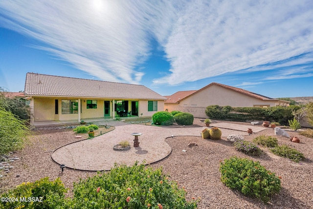 rear view of house with a patio