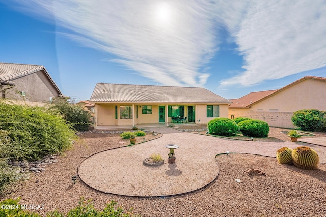 single story home featuring a patio