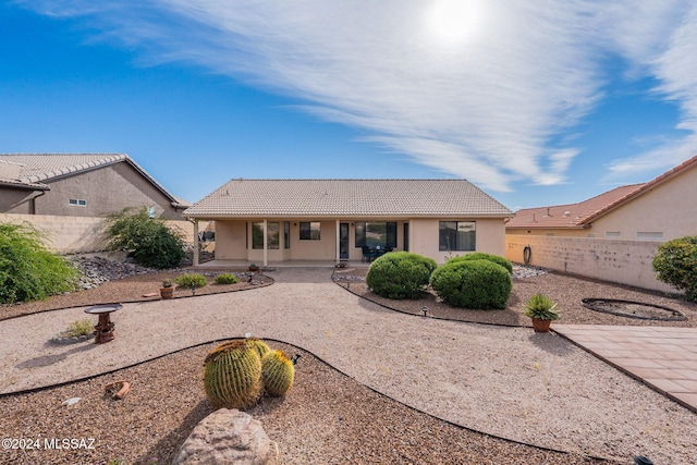 rear view of house featuring a patio