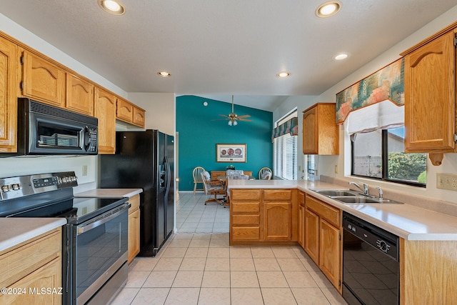 kitchen with kitchen peninsula, ceiling fan, light tile patterned floors, black appliances, and sink