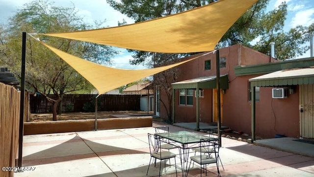 2112 E 18th St, Tucson, AZ 85719 - view of patio with a wall mounted air conditioner