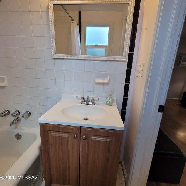 2112 E 18th St, Tucson, AZ 85719 - bathroom with shower / bath combination with curtain, vanity, and tile walls