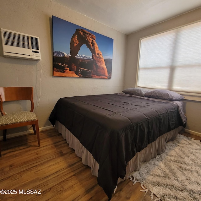 2112 E 18th St, Tucson, AZ 85719 - bedroom featuring hardwood / wood-style floors and a wall mounted air conditioner