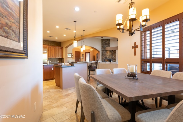 dining room with an inviting chandelier and sink