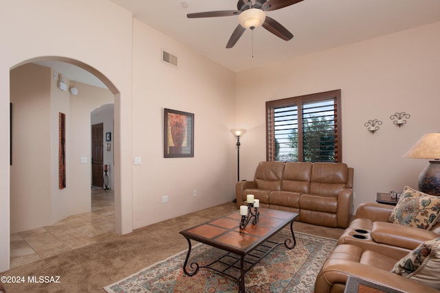 living room featuring ceiling fan and light colored carpet