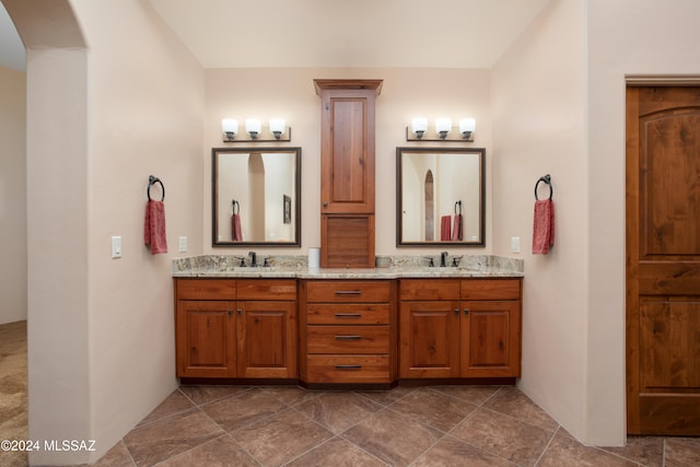 bathroom with tile patterned flooring and vanity