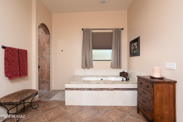 bathroom featuring separate shower and tub and tile patterned floors