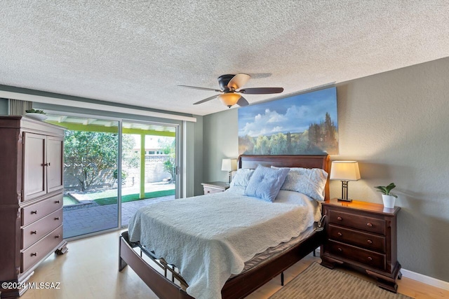 bedroom featuring a textured ceiling, access to outside, and ceiling fan