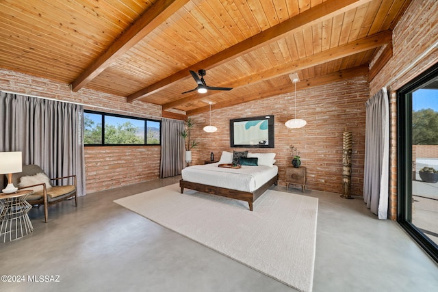 bedroom featuring finished concrete floors, access to exterior, multiple windows, and brick wall