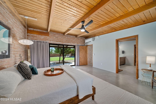 bedroom featuring ensuite bath, ceiling fan, access to exterior, a wall mounted AC, and concrete floors