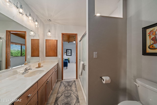 full bathroom with toilet, tile patterned flooring, baseboards, and vanity