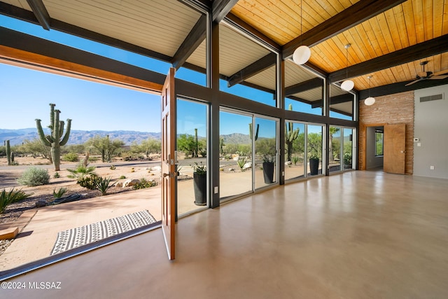 interior space featuring visible vents, a mountain view, and a ceiling fan