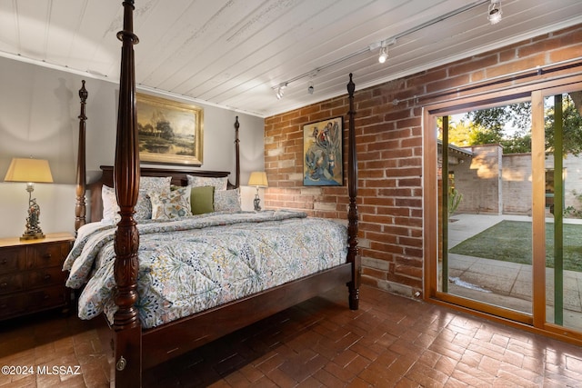 bedroom with access to exterior and crown molding