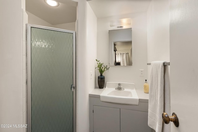 bathroom with vanity and walk in shower