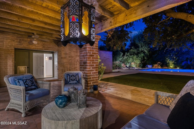 view of patio featuring ceiling fan