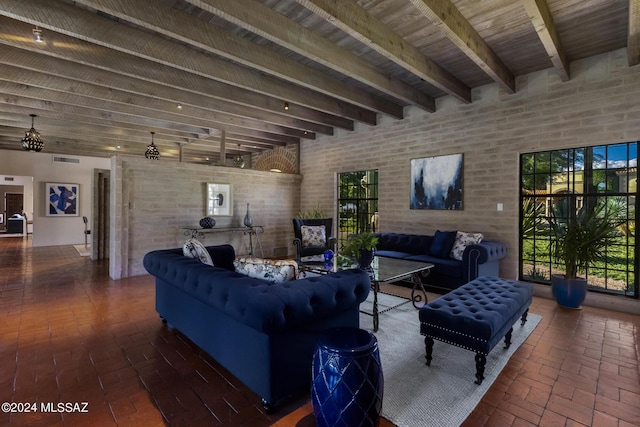 living room with beam ceiling and brick wall