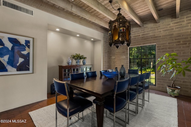 dining room with beam ceiling and wood ceiling