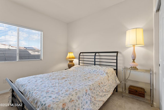 bedroom featuring baseboards and carpet floors