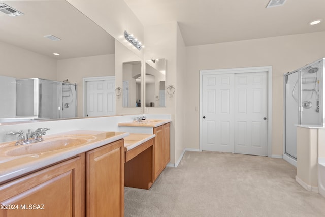 bathroom with vanity and independent shower and bath