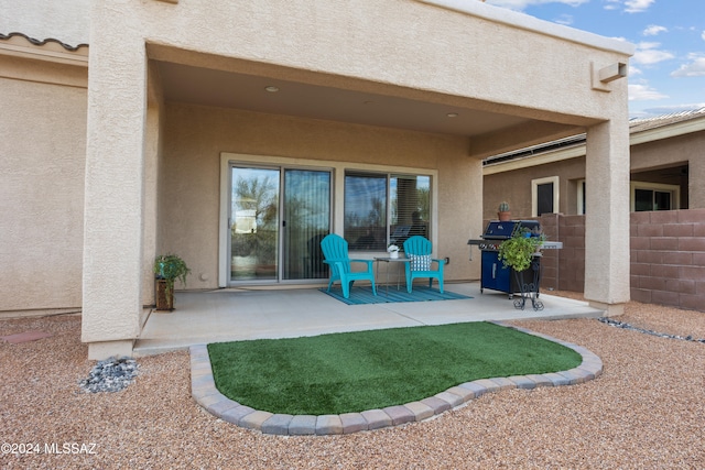 rear view of house featuring a patio