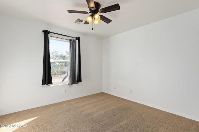 carpeted empty room with ceiling fan