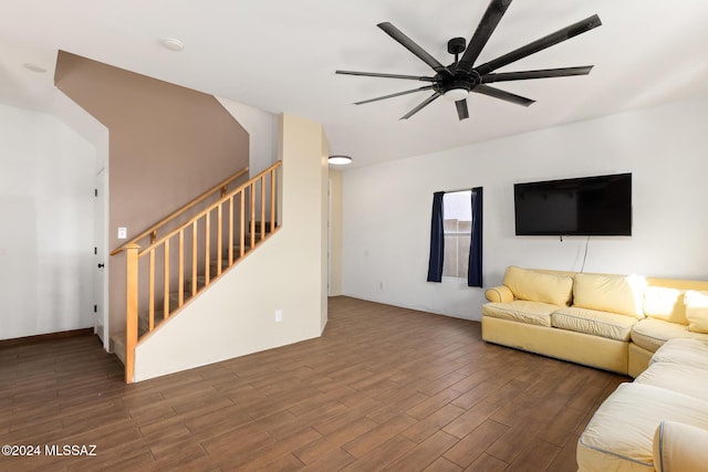 living room featuring dark hardwood / wood-style floors and ceiling fan