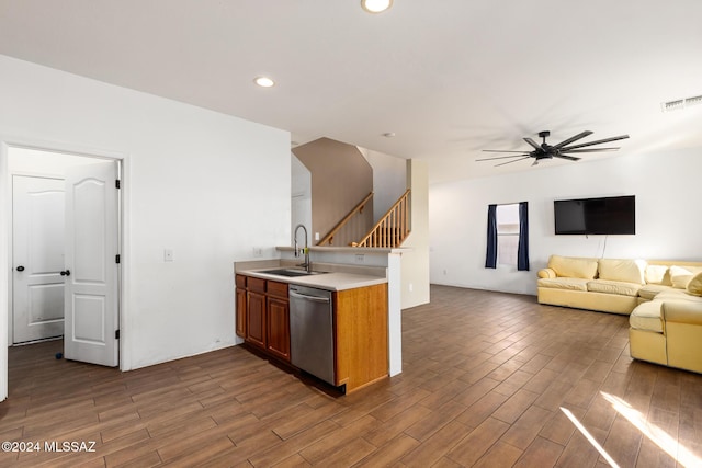 kitchen with ceiling fan, sink, stainless steel dishwasher, and dark hardwood / wood-style floors