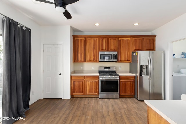 kitchen featuring hardwood / wood-style flooring, ceiling fan, and appliances with stainless steel finishes