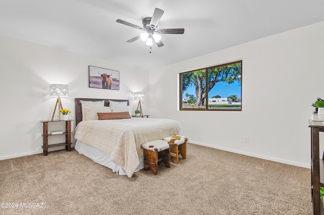 bedroom with dark carpet and ceiling fan