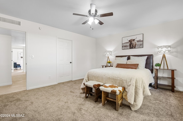 carpeted bedroom with ceiling fan