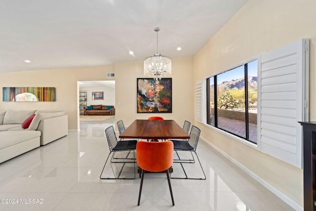 dining area with an inviting chandelier