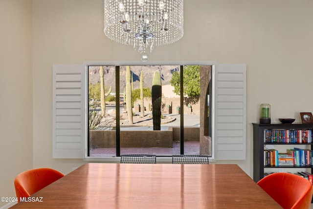 dining space with a chandelier