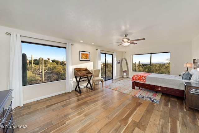 bedroom featuring ceiling fan and hardwood / wood-style floors