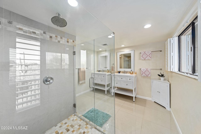 bathroom with vanity, tile patterned floors, and a shower with shower door